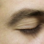 Woman plucking her eyebrows