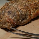 Fresh Raw pork tenderloin on wooden board .ready to cook