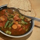 Beef Bourguignon in a white soup bowl on black stone