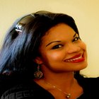 Smiling woman combing her hair