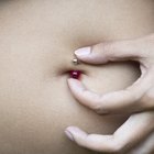 Woman tries on large gold ring
