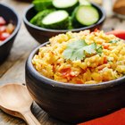 Unpolished rice on wooden background