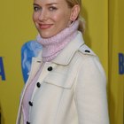 Woman Wearing Winter Clothing and Holding Woollen Hat