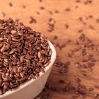 Flax seeds linseed on wooden spoon