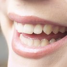 Close-up of mint leaves on a woman's tongue
