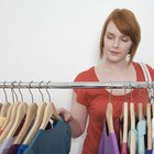 boy waiting for girl trying on clothes