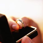 Woman tries on large gold ring