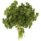 Fresh green, organic parsley on wooden table