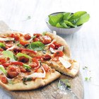Chef making pizza on table, elevated view