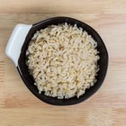 Unpolished rice on wooden background