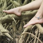 Close-up of a couple's feet on the beach
