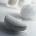 Vitamin C pills on white background