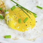 Boiled eggs on wooden background