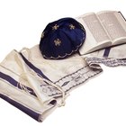 Rosh Hashanah Jewish New Year shofar,tallit. Isolated on black.