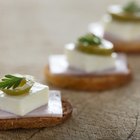 series of round forms of cheese for sale in market