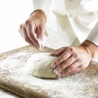 Mixing bowl, rolling pin and pie pan on kitchen counter