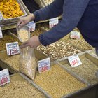 Hands tying bag of cereal in health food store