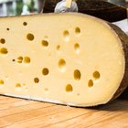 series of round forms of cheese for sale in market