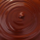 chocolate brownie diced baking paper on wooden table with a