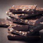 Stack of dark chocolate on a wooden table