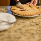 Mixing bowl, rolling pin and pie pan on kitchen counter