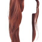 Woman styling another woman's hair