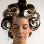 Father blowdrying daughter's (2-4) hair, close-up