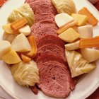 Uncooked pot roast on a bed of vegetables