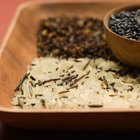 Unpolished rice on wooden background