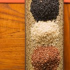 Unpolished rice on wooden background
