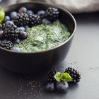 Young man making a smoothie