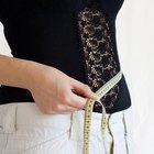 close-up of a woman measuring her bust