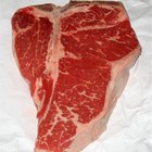 Top loin steaks on cutting board, high angle view, close up