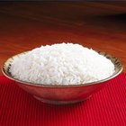 Unpolished rice on wooden background