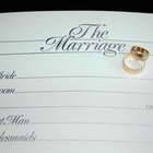 Groom placing ring on brides finger