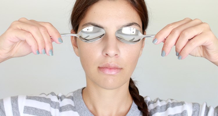 Cold spoons work to reduce puffy eyes.