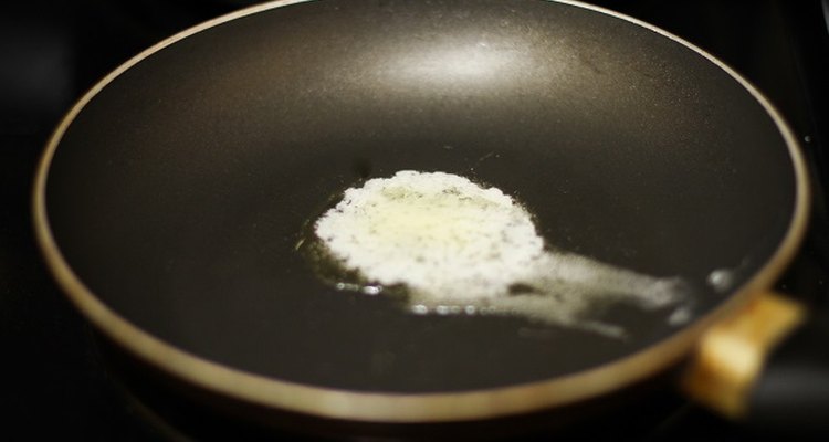 Butter melting in a skillet.