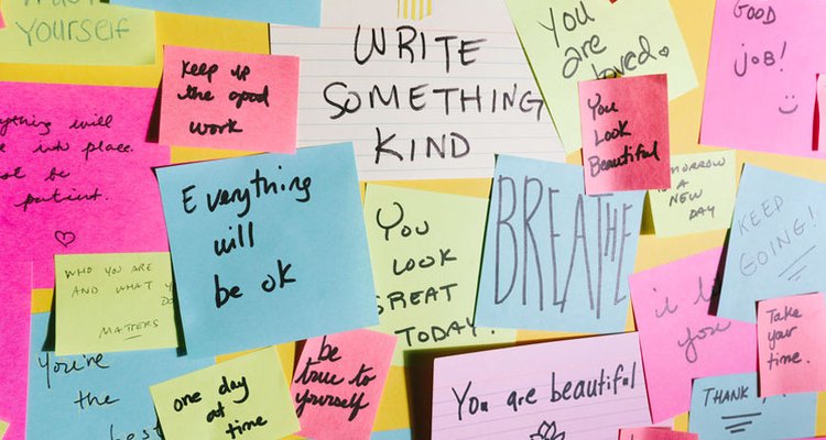 wall covered in notes with positive sayings