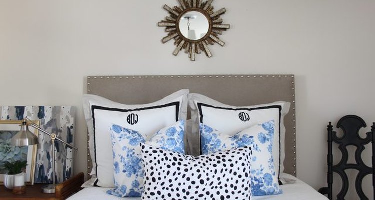 Bed with padded headboard.