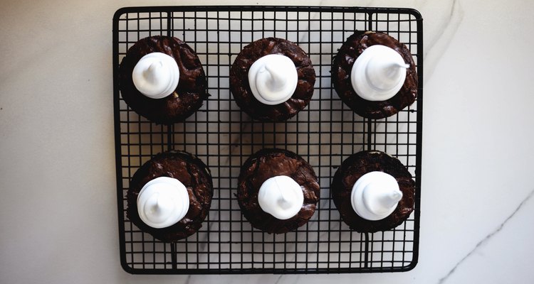 Pipe the marshmallow meringue into neat and little ghost shapes.