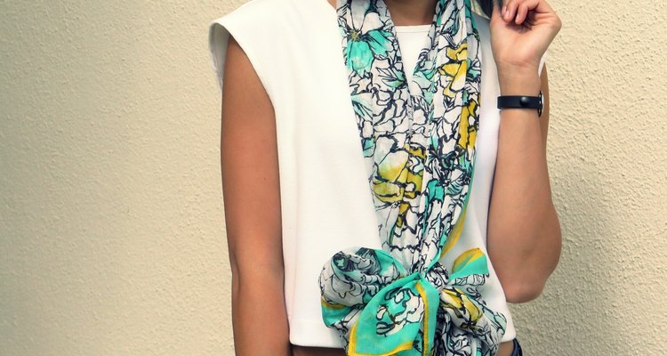 A completed bow scarf hangs at your waist.