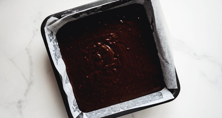 Divide the batter evenly between the cake pans.