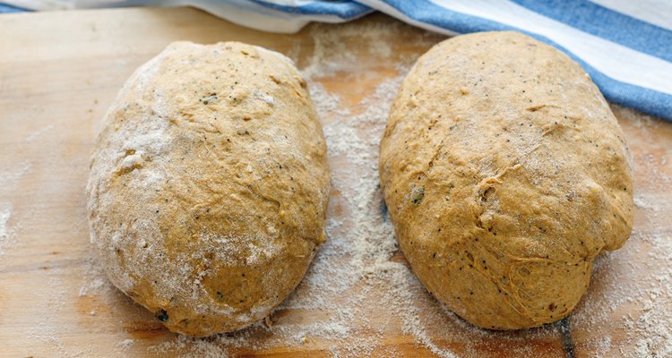 Preparing dough for baking homemade pumpkin bread.