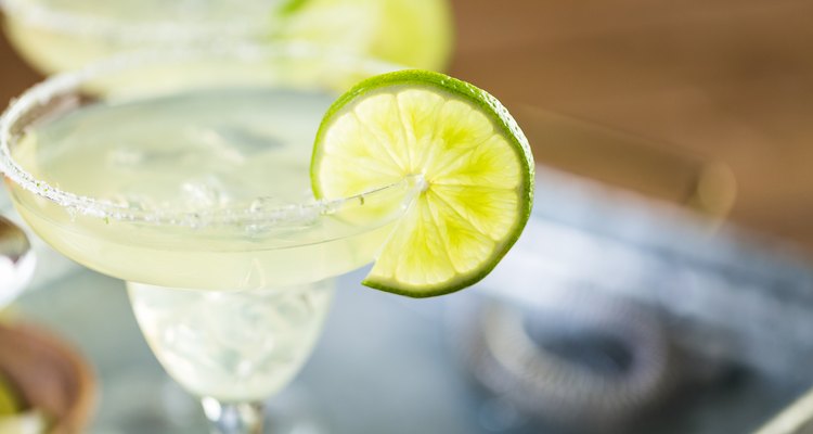 Key lime margarita garnished with fresh lime