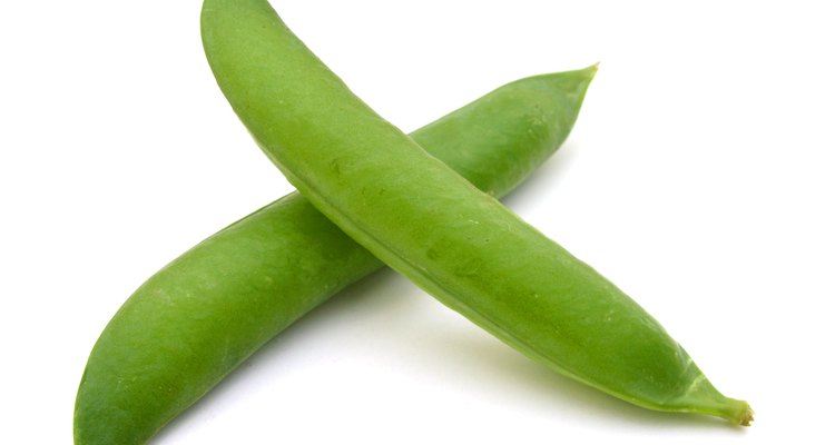 fresh green peas isolated on a white background