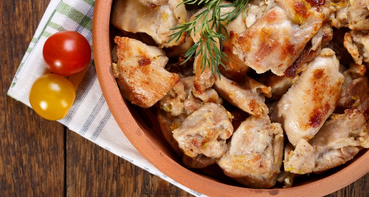 Roasted chicken meat pieces. Grilled boneless skinless chicken thigh. Top view.