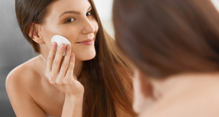 Spa Woman. Beautiful Woman Cleaning Her Face. Cosmetology