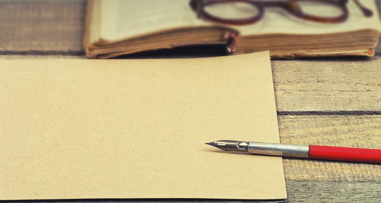 old paper, pen, book and glasses