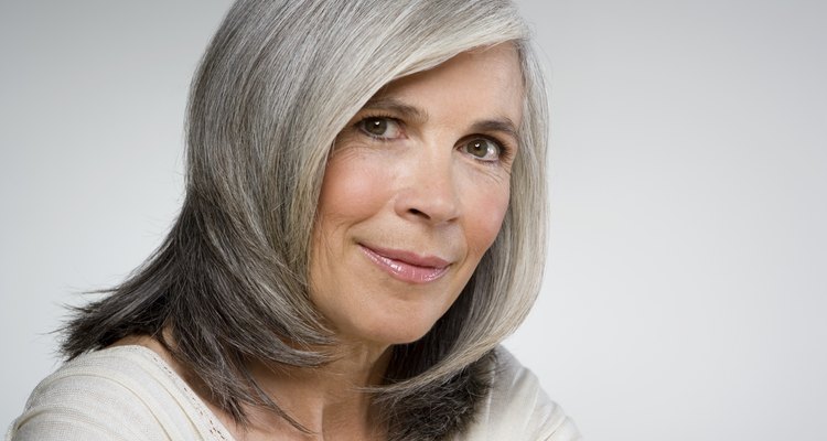 Mature woman smiling, portrait, close-up