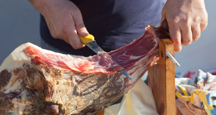 Man slicing Dalmatian prosciutto